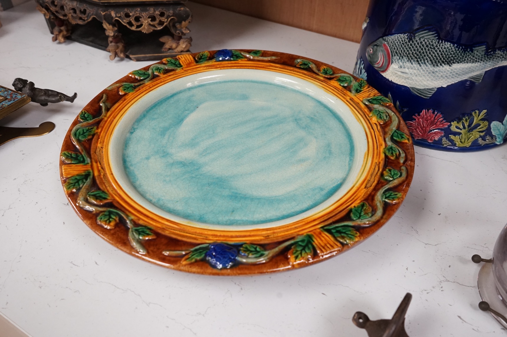 A Victorian majolica cheese dome decorated with fish and seaweed, and a later dish, dome 23cm high, 23cm diameter, dish 24cm internal diameter